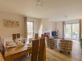 Courtyard Cottage 8 The open plan living and dining area in Taigh Nan Caorach accommodation at Abbey Holidays Loch Ness