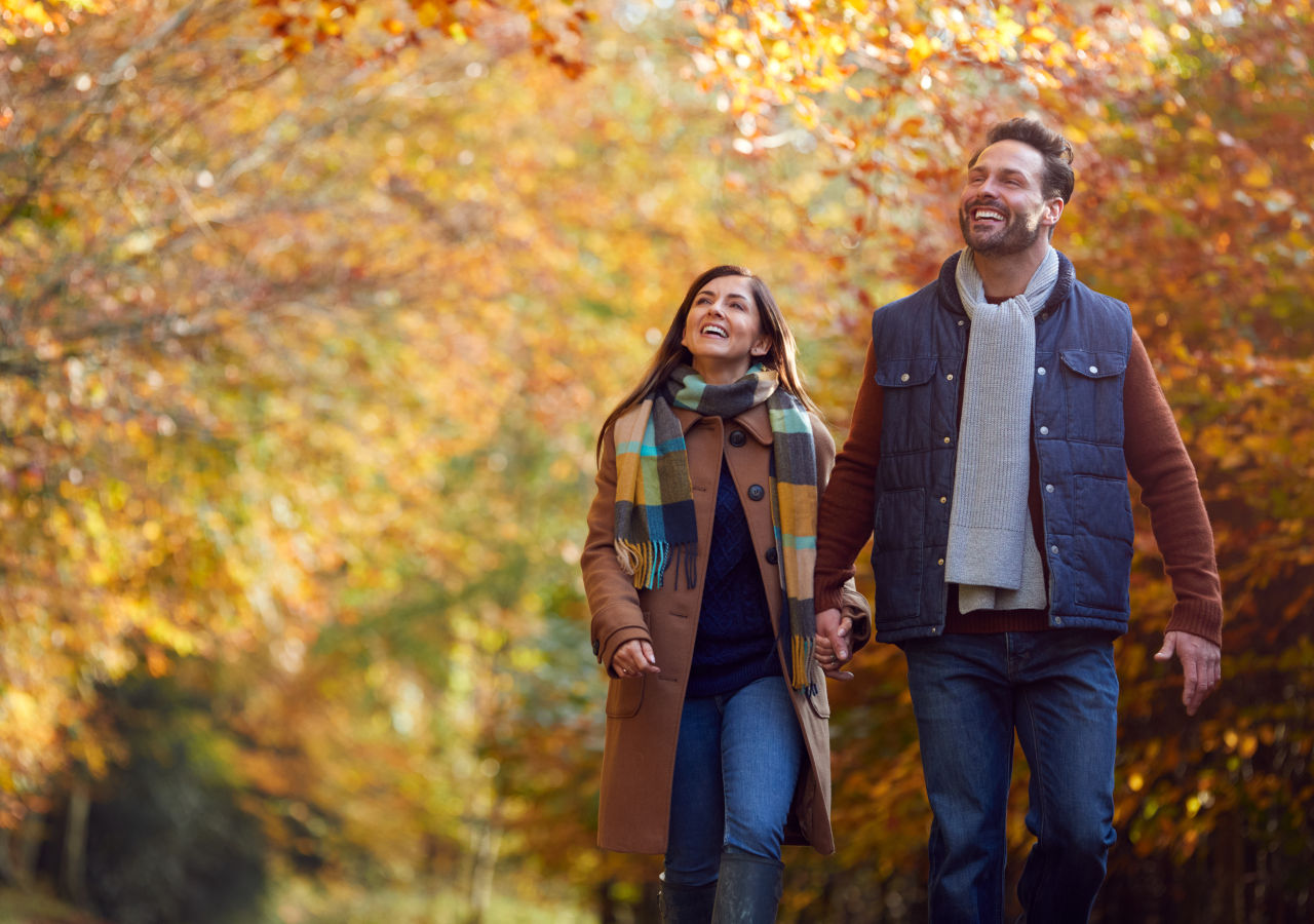 Couple walking in the autumn trees