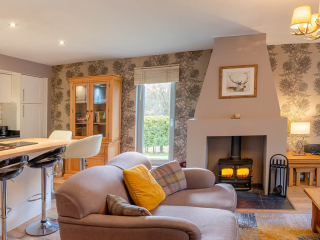 Courtyard Cottage 11 The open plan living, dining and kitchen in the Strath Glass accommodation at Abbey Holidays Loch Ness