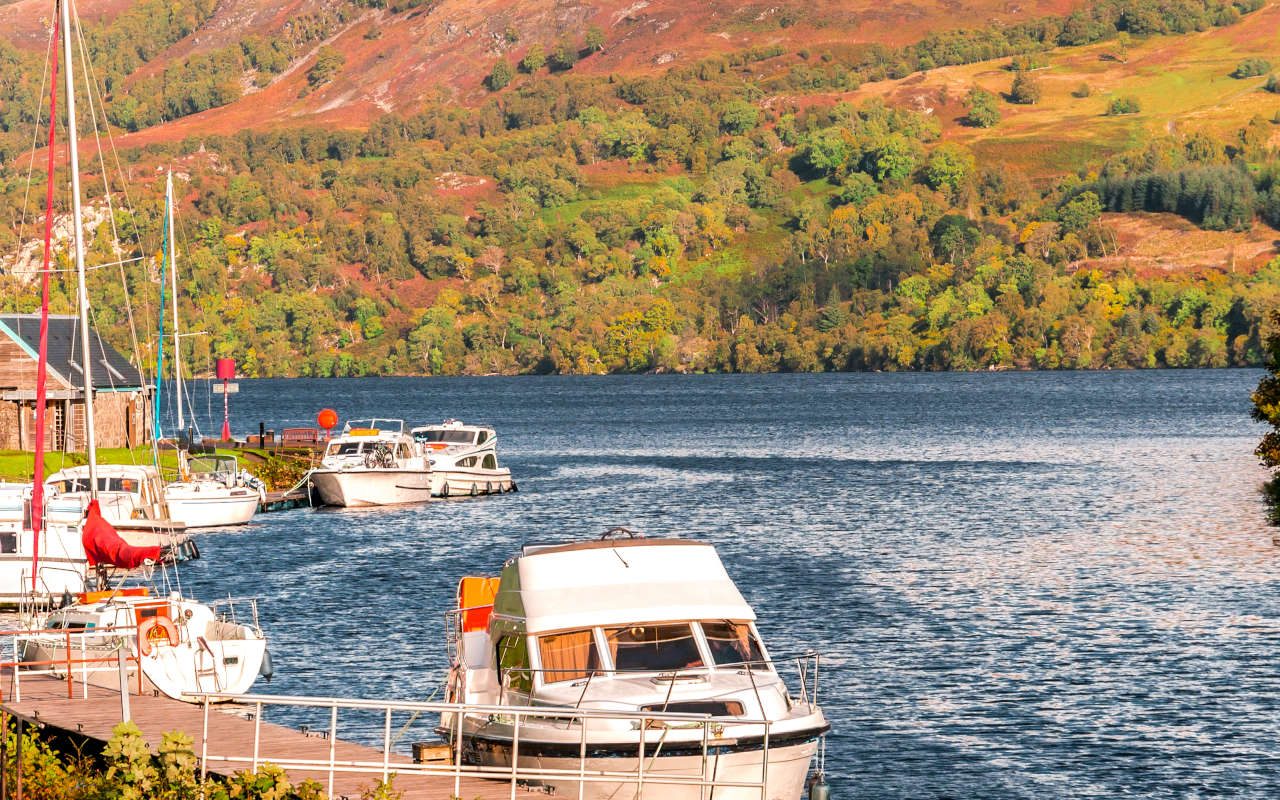 Boats docked at south west part of Loch Ness lwhere it meets Caledonian Canal at Fort Augustus