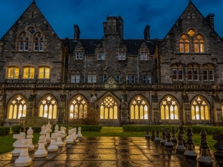 The cloisters garden at night with outdoor giant chess.