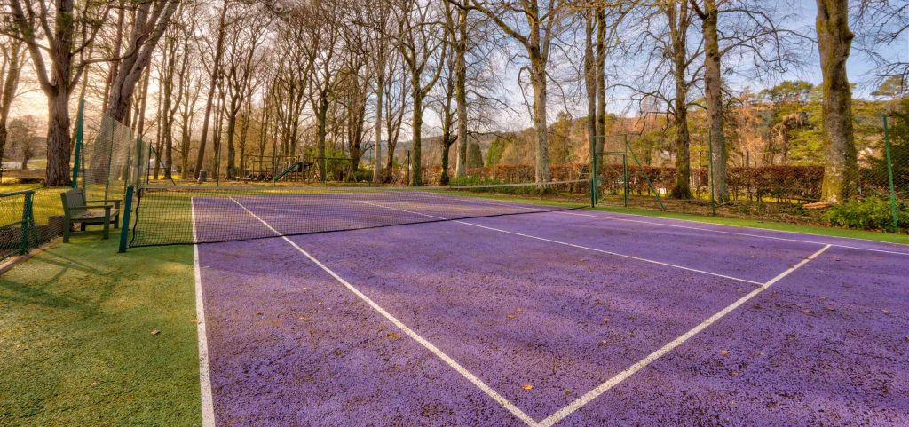 The outdoor tennis court at abbey holidays on loch ness.