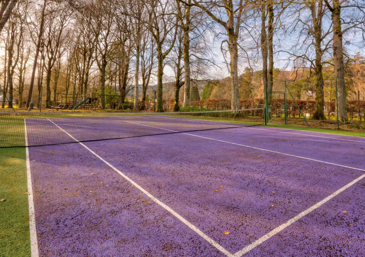 The outdoor tennis court at abbey holidays on loch ness.