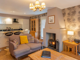 Living Room Courtyard Cottage 11 Interior view of Cottage 11 at abbey Holidays Loch Ness