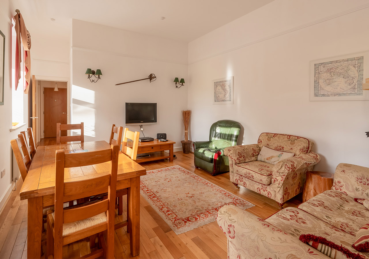 The living and dining room in the Major’s Apartment accommodation at Abbey Holidays in Loch Ness