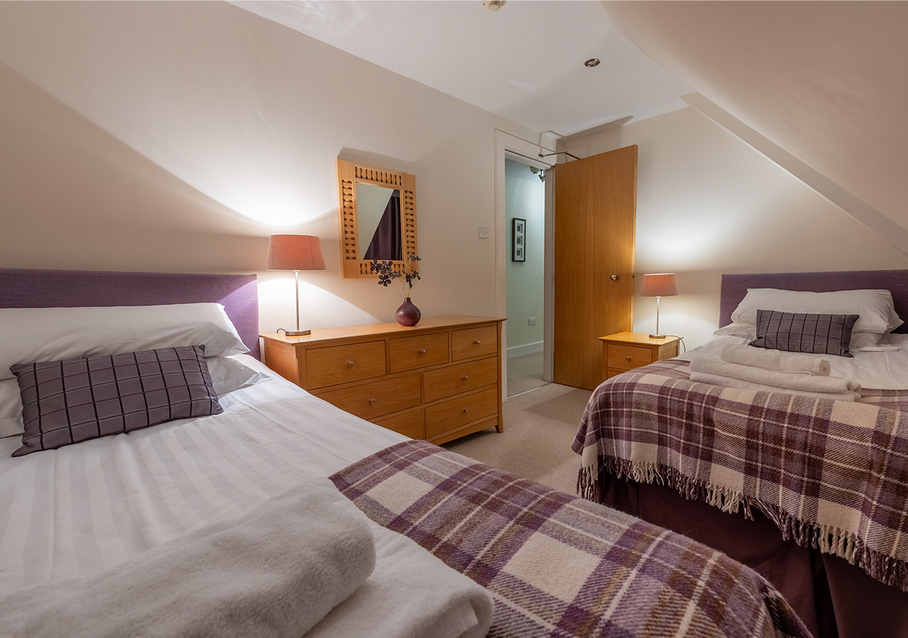 A twin room in The Ross accommodation at Abbey Holidays in Loch Ness