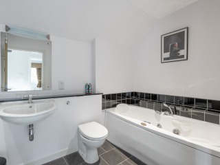 Cottage 2, Fort Augustus Abbey, February 2024 Cottage 2 bathroom with shower cubicle and shower in bath.