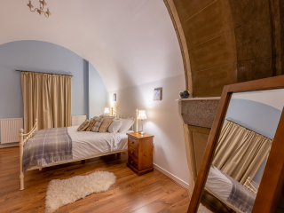 Abbey Church 24 Upper North Aisle Bedroom 3 Abbey Church 24 - Upper North Aisle accommodations double room with spectacular arch at Abbey Holidays by Loch Ness