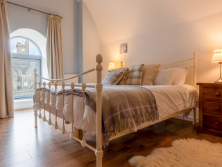 Abbey Church 24 Upper North Aisle Bedroom Abbey Church 24 - Upper North Aisle accommodations double room with spectacular arch at Abbey Holidays by Loch Ness