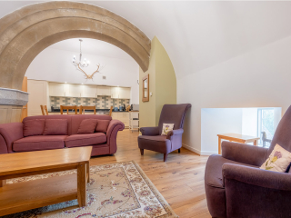 Abbey Church 24 Upper North Aisle Living Room 2 Living Room Abbey Church 24 - Upper North Aisle accommodations stunning arched living room at Abbey Holidays by Loch Ness
