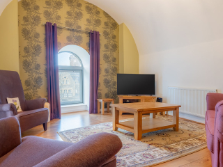 Abbey Church 24 Upper North Aisle Living Room 3 Abbey Church 24 - Upper North Aisle accommodations arched living room at Abbey Holidays by Loch Ness