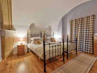 Abbey Church 24 Upper North Aisle Twin Room Abbey Church 24 - Upper North Aisle accommodations arched twin room at Abbey Holidays by Loch Ness