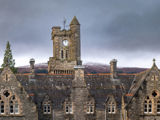 The historical exterior of Fort Augustus Abbey housing Abbey Church 25 - The Dunfermline accommodations at Abbey Holidays by Loch Ness