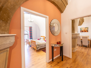 Abbey Church 25 - The Dunfermline accommodations hallway with stunning stone arch at Abbey Holidays by Loch Ness