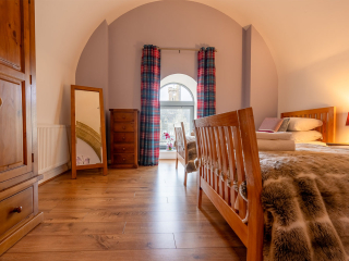Abbey Church 25 - The Dunfermline accommodations arched twin bedroom at Abbey Holidays by Loch Ness