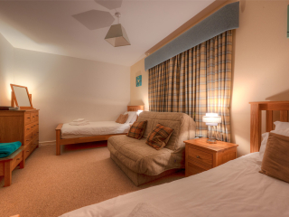 Courtyard Cottage 2 Club Cottage twin bedroom at Abbey Holidays by Loch Ness