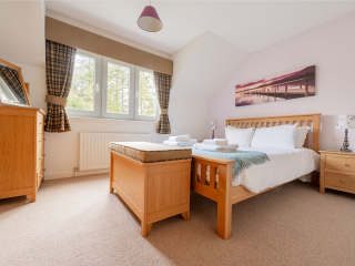 Courtyard Cottage 2 Club Cottage double bedroom at Abbey Holidays by Loch Ness