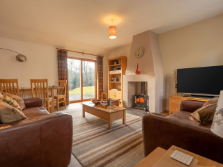 Courtyard Cottage 2 Club Cottage open plan living dining room at Abbey Holidays by Loch Ness