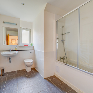 Courtyard Cottage 4 - Brora accomodation&#039;s bathroom with shower over bath at Abbey Holidays Loch Ness