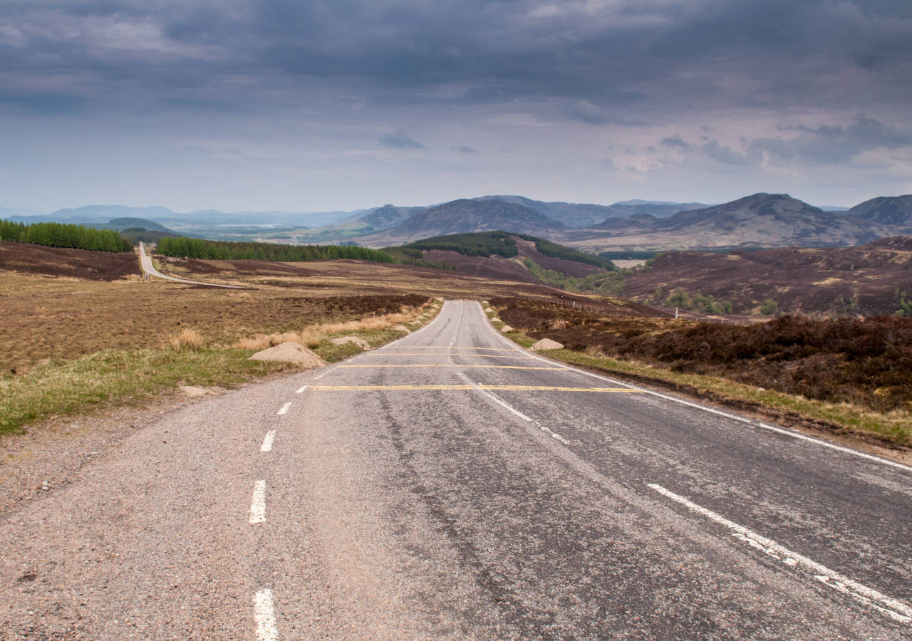 The long straight 18th century military road of General Wade crosses the remote landscape of Stratherrick