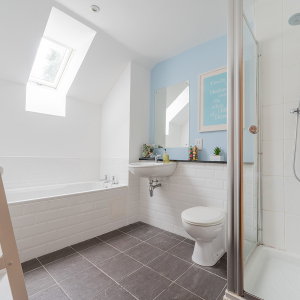 Strath Glass accommodation&#039;s bathroom separate shower over bath at Abbey Holidays Loch Ness