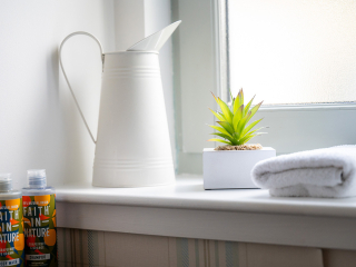 Strath Glass accommodation&#039;s bathroom detail with Faith in Nature toiletries at Abbey Holidays Loch Ness