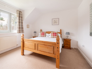 Strath Glass accommodation&#039;s double bedroom at Abbey Holidays Loch Ness