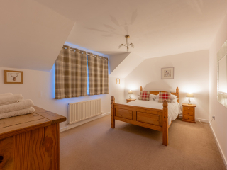 Strath Glass accommodation&#039;s double bedroom at Abbey Holidays Loch Ness