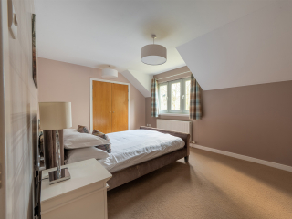 Strath Glass accommodation&#039;s double bedroom at Abbey Holidays Loch Ness