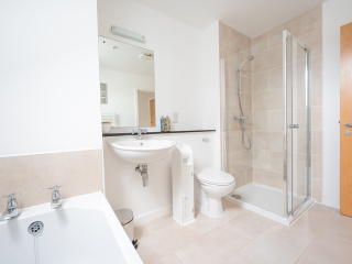 Courtyard Cottage 8 - Taigh Nan Caorach accommodation&#039;s bathroom with separate bath and shower at Abbey Holidays Loch Ness