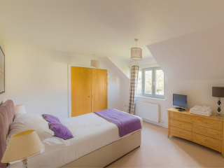 Courtyard Cottage 8 - Taigh Nan Caorach accommodation&#039;s double bedroom at Abbey Holidays Loch Ness