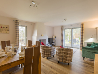 Courtyard Cottage 8 - Taigh Nan Caorach accommodation&#039;s living and dining room at Abbey Holidays Loch Ness