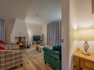 Courtyard Cottage 8 - Taigh Nan Caorach accommodation&#039;s living room at Abbey Holidays Loch Ness