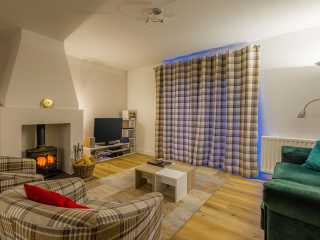 Courtyard Cottage 8 - Taigh Nan Caorach accommodation&#039;s living room at Abbey Holidays Loch Ness