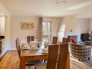 Courtyard Cottage 8 - Taigh Nan Caorach accommodation&#039;s open plan living at Abbey Holidays Loch Ness