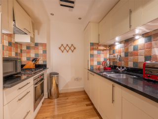 Moat House 2 - Major&#039;s Apartment accommodation&#039;s kitchen at Abbey Hoildays Loch Ness
