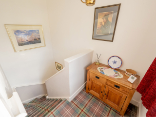 Moat House 2 - Major&#039;s Apartment accommodation&#039;s landing and stairs at Abbey Hoildays Loch Ness