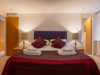 Moat House 5 The Ross accommodation&#039;s double bedroom at Abbey Holidays Loch Ness