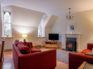 Moat House 5 The Ross accommodation&#039;s living dining room at Abbey Holidays Loch Ness
