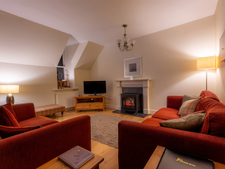 Moat House 5 The Ross accommodation&#039;s living dining room at Abbey Holidays Loch Ness