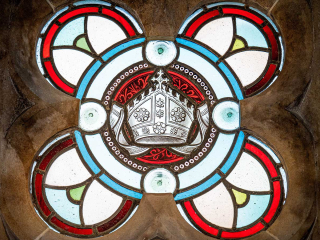 Moat House 5 The Ross accommodation&#039;s stained glass window detail at Abbey Holidays Loch Ness