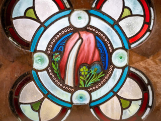 Moat House 5 The Ross accommodation&#039;s stained glass window detail at Abbey Holidays Loch Ness