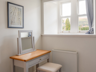 Monastery 10 - Brunel accommodation&#039;s double bedroom dressing table with lovely views from the window at Abbey Holidays Loch Ness