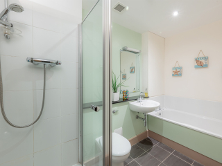 The Caledonian - Old School 12 accommodation&#039;s bathroom with separate shower and bath at Abbey Holidays Loch Ness