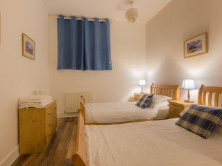 The Caledonian - Old School 12 accommodation&#039;s twin bedroom at Abbey Holidays Loch Ness