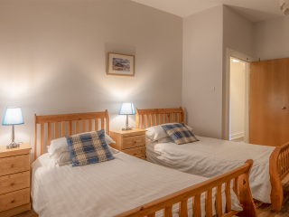 The Caledonian - Old School 12 accommodation&#039;s twin bedroom at Abbey Holidays Loch Ness