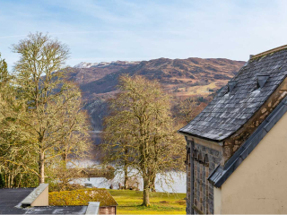 The Caledonian - Old School 12 accommodation&#039;s view of Loch Ness and the hills at Abbey Holidays Loch Ness
