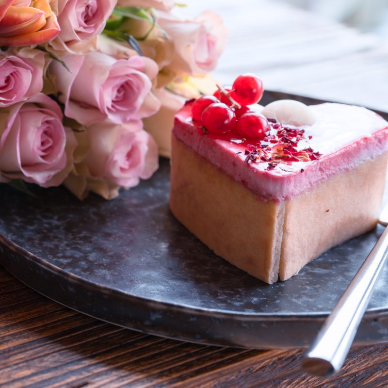 Pink roses and a slice of birthday cake