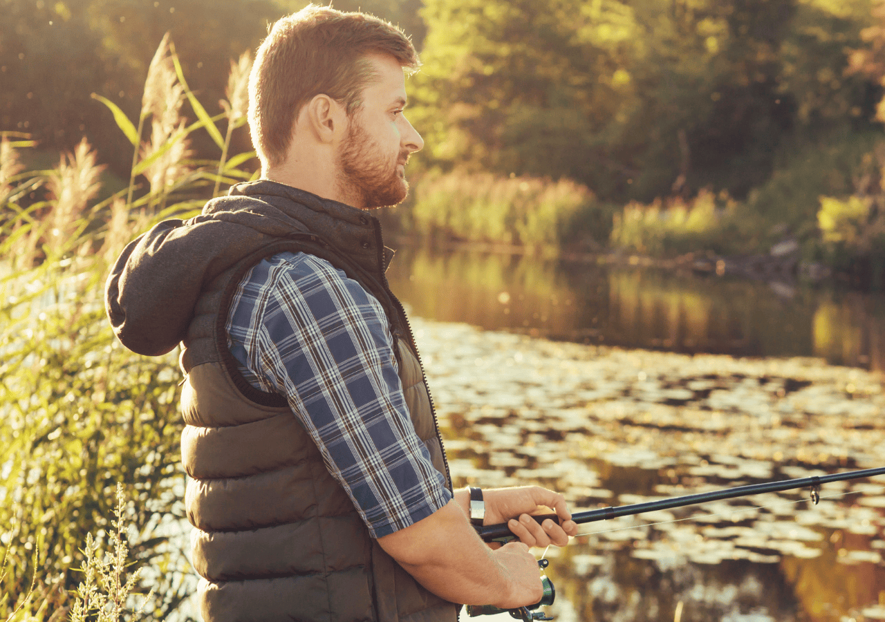 A man fishing a river.