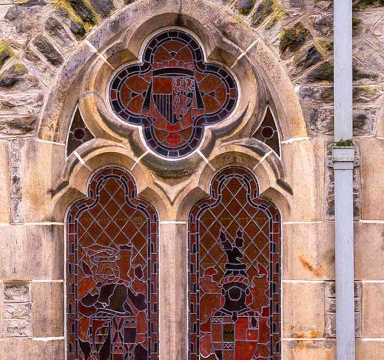 Brothers Wing 7 - Cannon Point accommodation's exterior beautiful arched church windows at Abbey Holidays Loch Ness